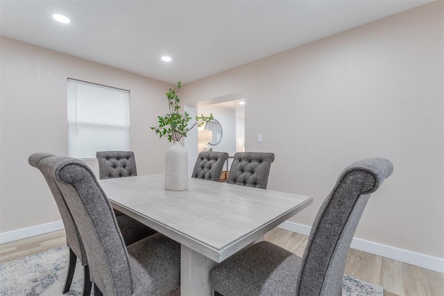 dining area featuring recessed lighting, baseboards, and light wood finished floors