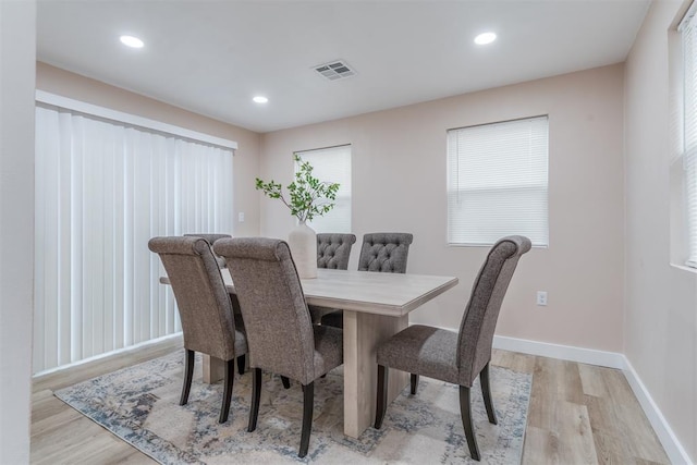 dining space with recessed lighting, baseboards, visible vents, and light wood finished floors