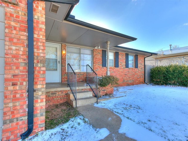 view of front of property featuring brick siding