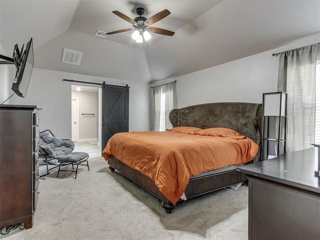 bedroom with light carpet, a barn door, visible vents, a ceiling fan, and vaulted ceiling