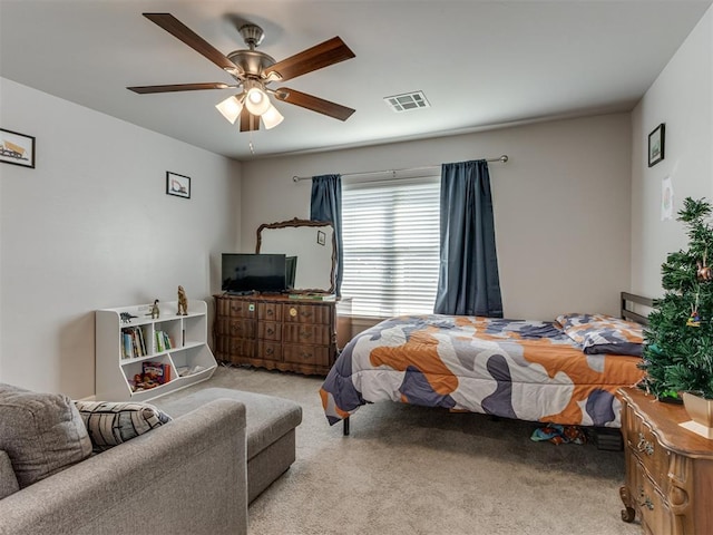 bedroom featuring ceiling fan, carpet, and visible vents