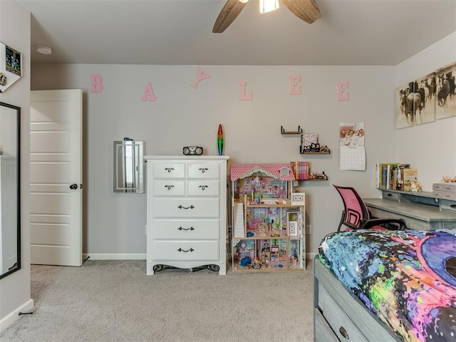 carpeted bedroom featuring a ceiling fan and baseboards