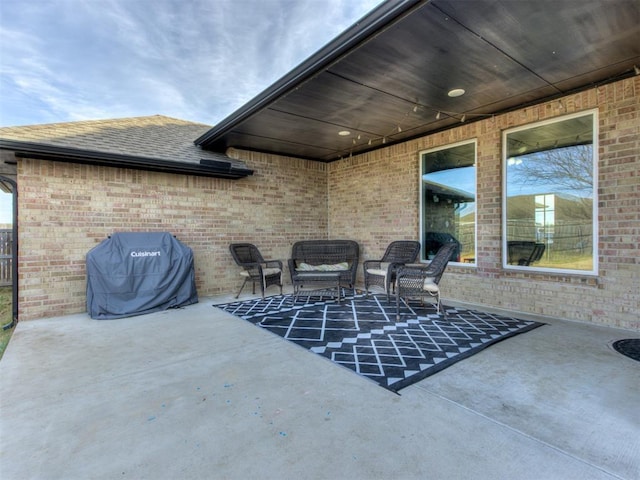 view of patio featuring a grill