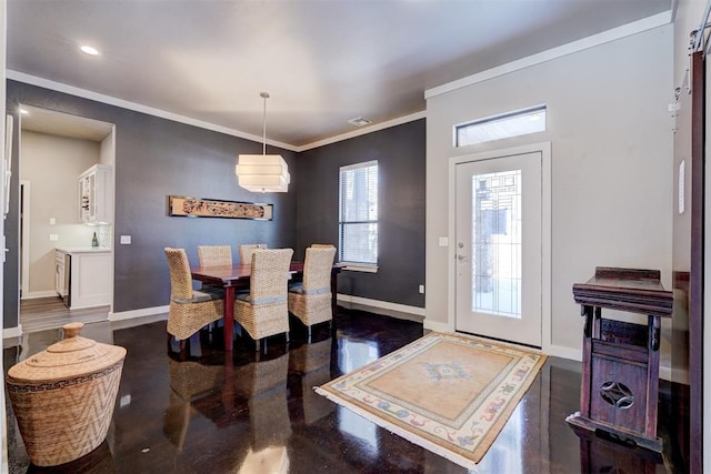 dining room with visible vents, crown molding, and baseboards