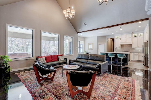 living room featuring baseboards, visible vents, high vaulted ceiling, a notable chandelier, and recessed lighting