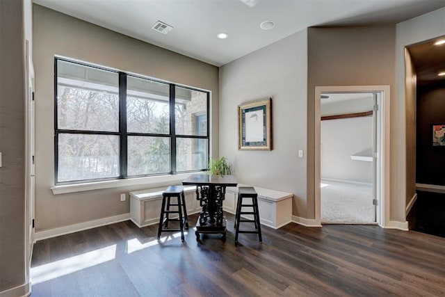 office space featuring baseboards, visible vents, dark wood finished floors, and recessed lighting