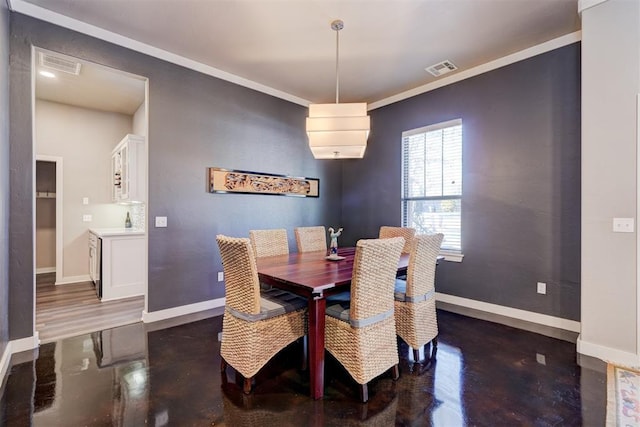 dining space featuring ornamental molding, visible vents, and baseboards