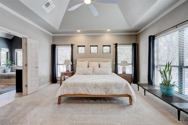 bedroom with light carpet, high vaulted ceiling, multiple windows, and visible vents