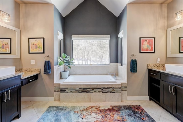 full bathroom with lofted ceiling, vanity, tile patterned flooring, and a bath