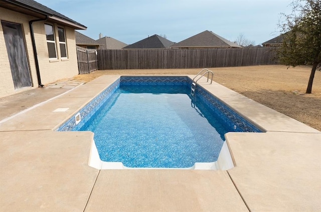 view of swimming pool with a fenced in pool, a patio, and a fenced backyard