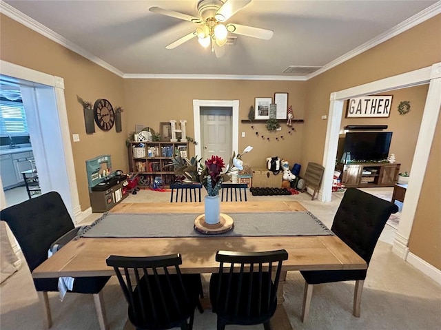 dining area featuring ceiling fan, ornamental molding, and baseboards