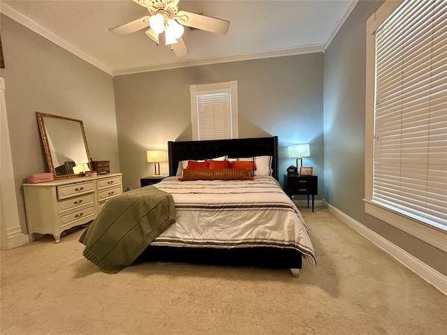 bedroom with light carpet, ornamental molding, a ceiling fan, and baseboards