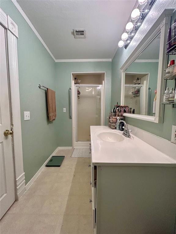 full bath with a stall shower, visible vents, crown molding, and vanity