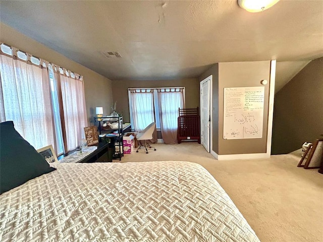 bedroom with light carpet and visible vents