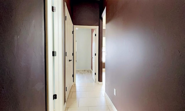 corridor featuring light tile patterned floors