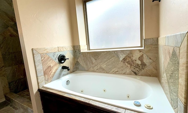 full bathroom featuring a whirlpool tub