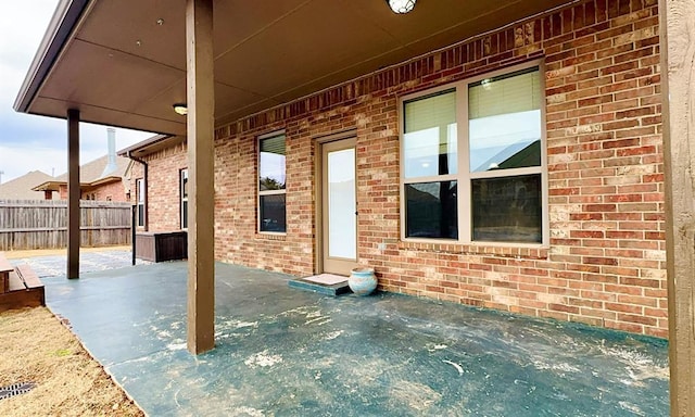 view of patio / terrace featuring fence