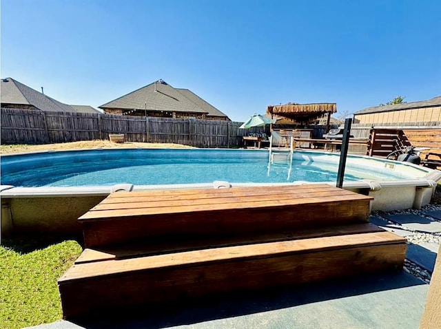 view of pool with a fenced in pool and fence private yard