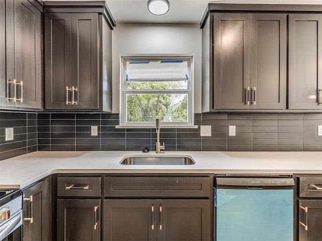 kitchen with dishwashing machine, light countertops, a sink, stainless steel electric range, and backsplash