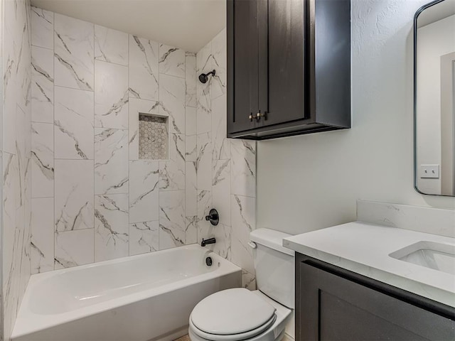 bathroom featuring washtub / shower combination, vanity, and toilet
