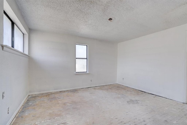 empty room featuring a textured ceiling