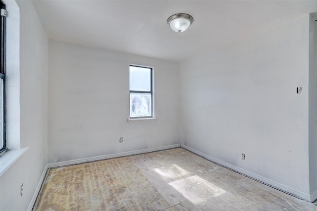 empty room with baseboards