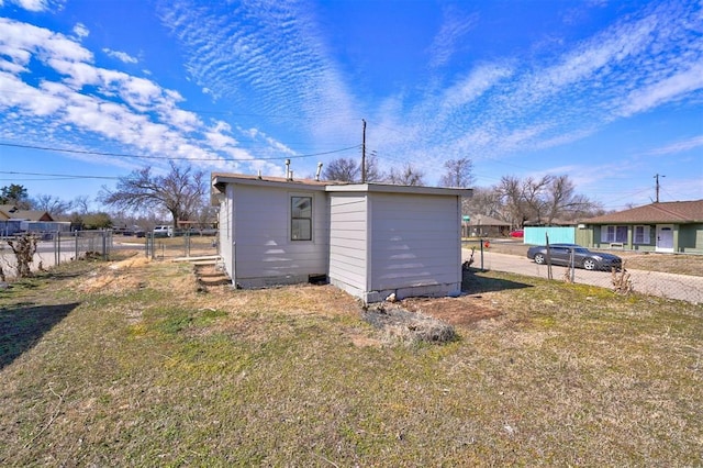 view of outdoor structure with an outbuilding and fence