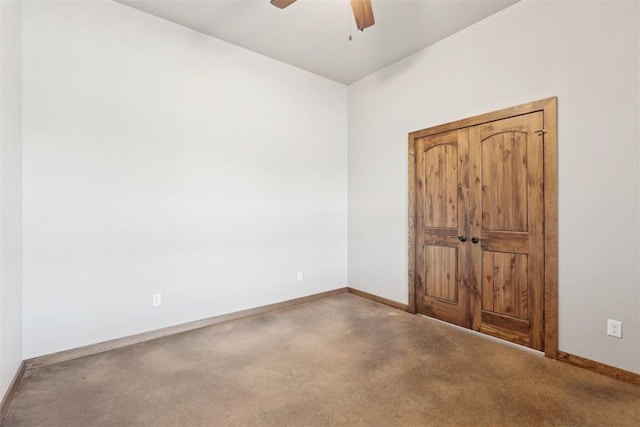 unfurnished bedroom with a ceiling fan and baseboards