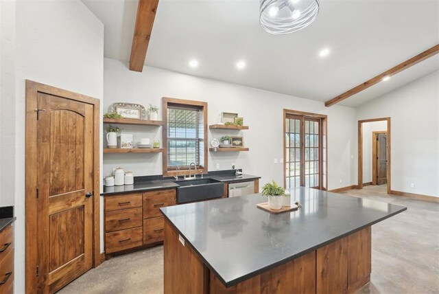 kitchen with open shelves, a kitchen island, dark countertops, and a sink