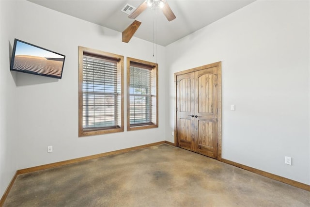 interior space featuring baseboards, visible vents, ceiling fan, and a closet