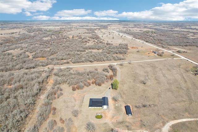 birds eye view of property with view of desert and a rural view