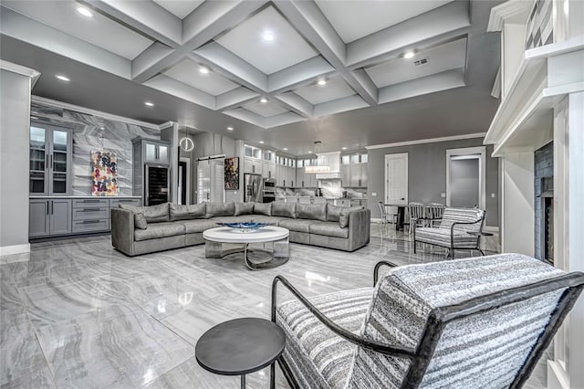 living area featuring beamed ceiling, coffered ceiling, and marble finish floor