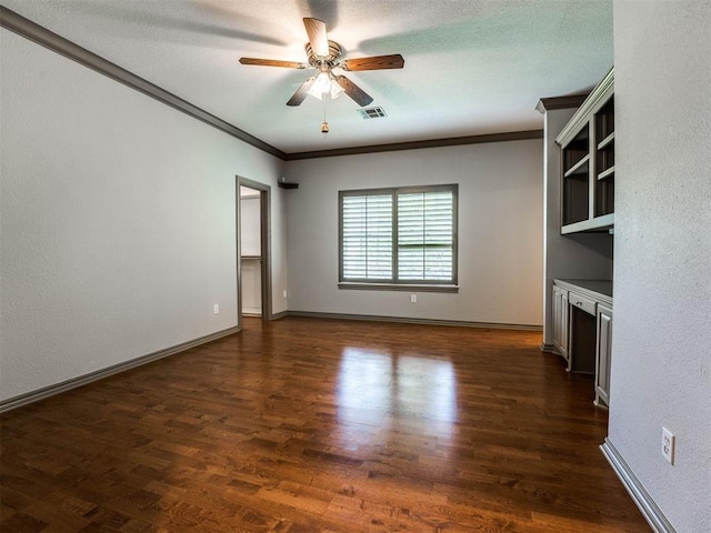 unfurnished living room featuring baseboards, a ceiling fan, ornamental molding, and dark wood finished floors