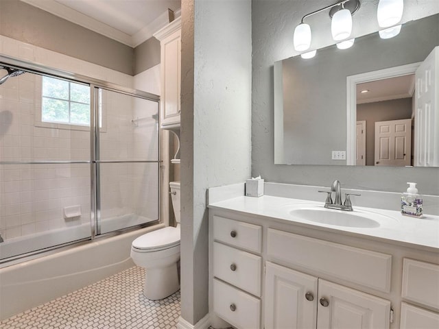 bathroom featuring bath / shower combo with glass door, toilet, ornamental molding, a textured wall, and vanity