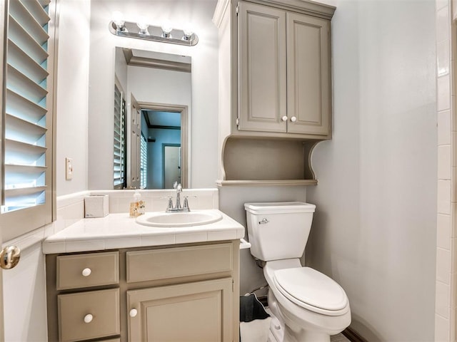 bathroom with toilet and vanity