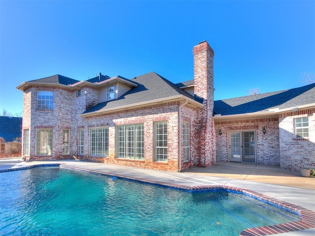 pool with a patio