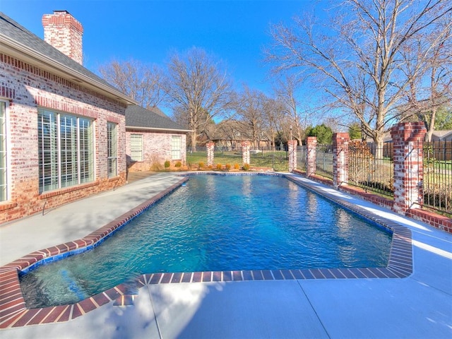 view of pool featuring a patio area, a fenced in pool, and fence