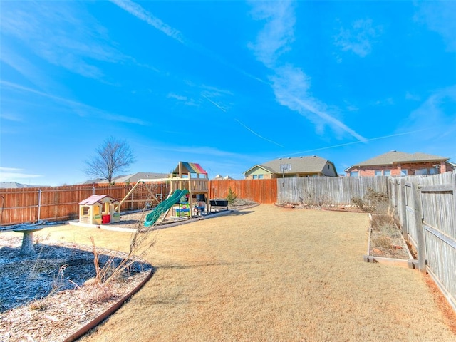 view of play area with a fenced backyard