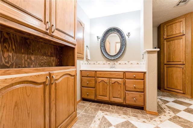 bathroom featuring visible vents and vanity