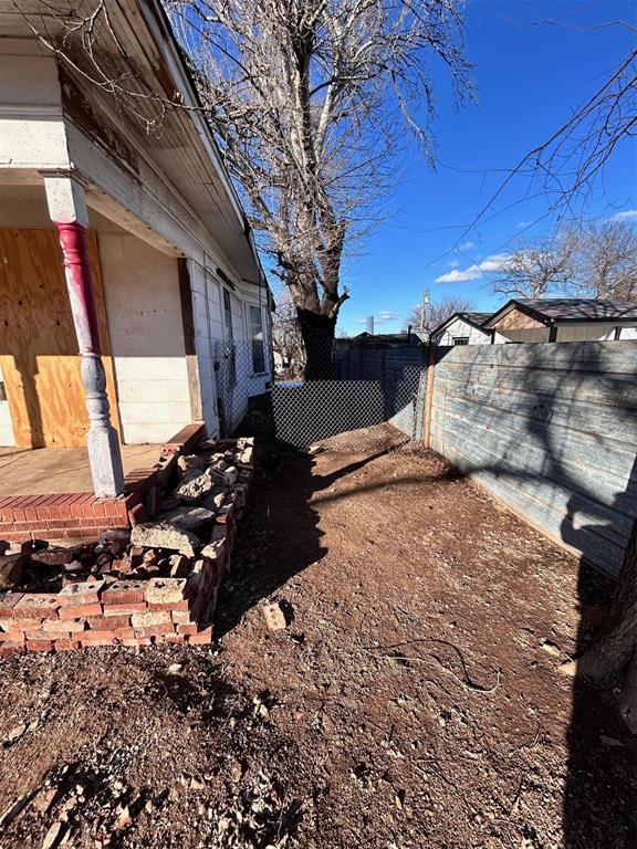 view of yard featuring fence