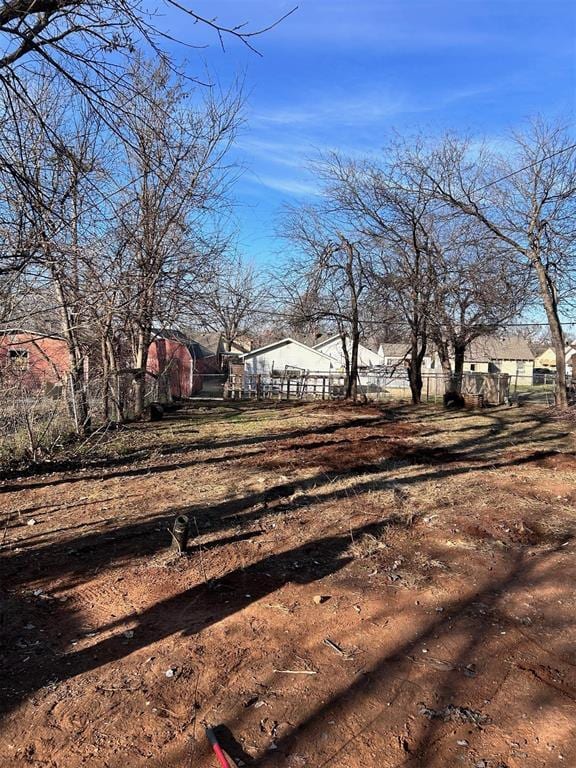 view of yard featuring a residential view and fence