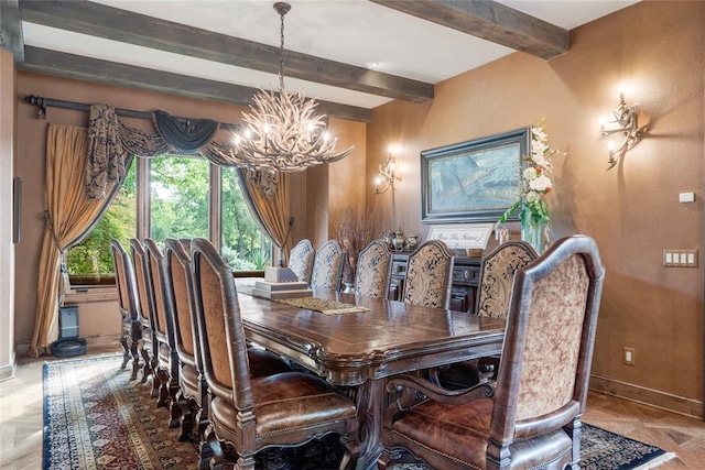 dining room with a chandelier, beamed ceiling, and baseboards