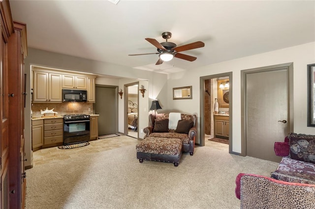 living room featuring light carpet and a ceiling fan