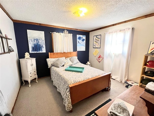 bedroom featuring ornamental molding, carpet flooring, and a textured ceiling