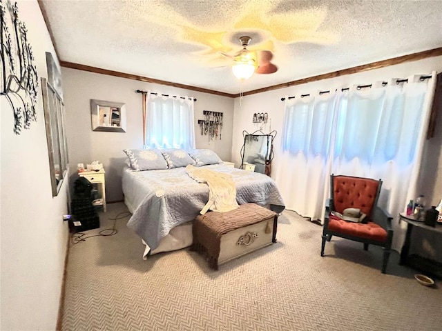 bedroom featuring crown molding, ceiling fan, a textured ceiling, and light colored carpet