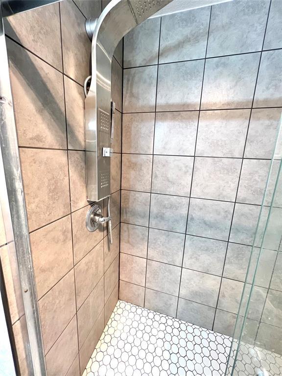 bathroom featuring a stall shower