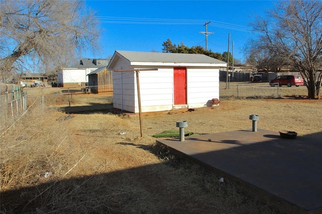 view of outdoor structure featuring fence