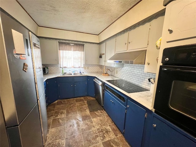 707 S Third St, Cheyenne, OK 73628 - kitchen featuring blue cabinetry, under cabinet range hood, black appliances, a textured ceiling, and decorative backsplash