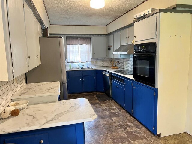 707 S Third St, Cheyenne, OK 73628 - kitchen featuring black appliances, under cabinet range hood, blue cabinetry, a textured ceiling, and backsplash