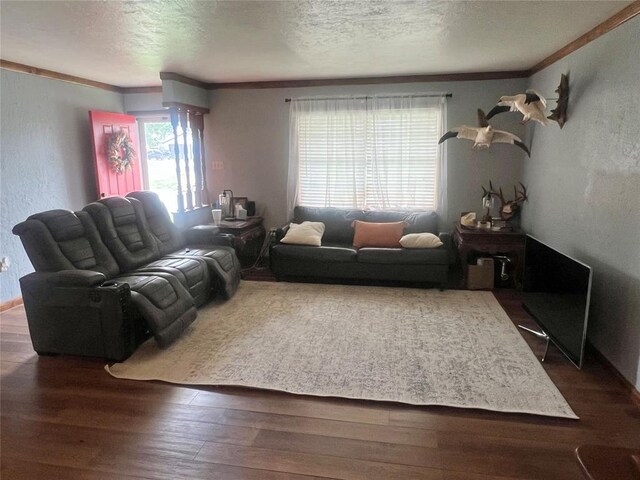 707 S Third St, Cheyenne, OK 73628 - living area with plenty of natural light, crown molding, wood finished floors, a textured ceiling, and a textured wall